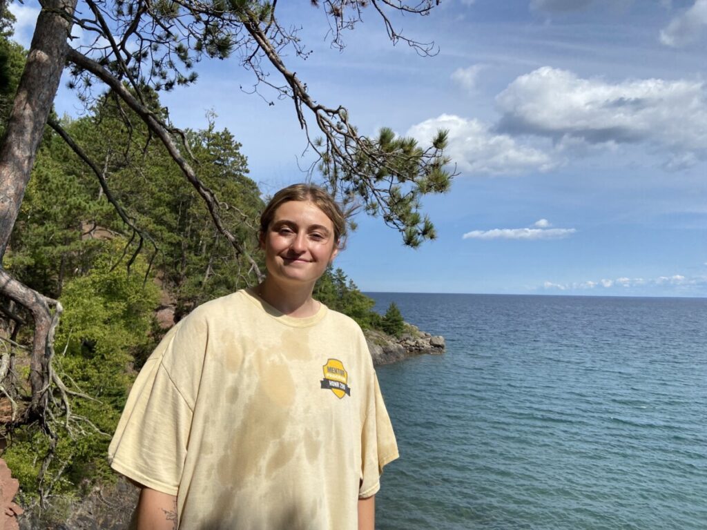Abbie at Little Presque Isle with Lake Superior behind her