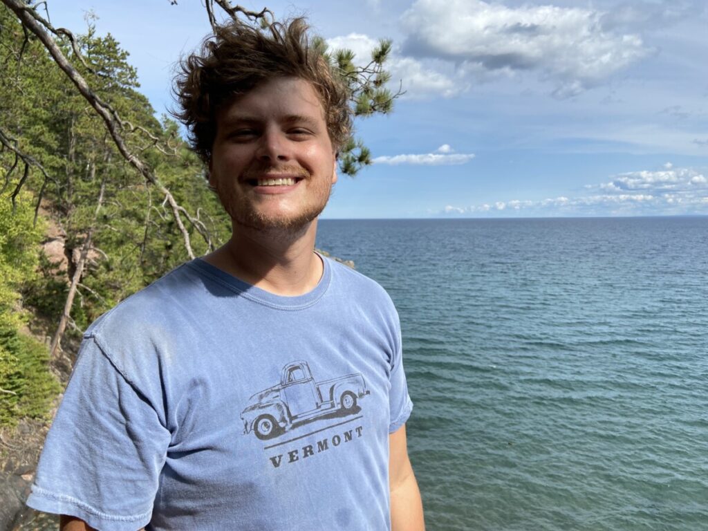 Jake at Little Presque Isle with Lake Superior Behind him