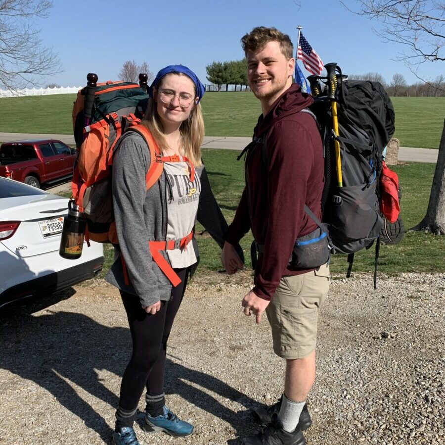 Abbie and Jacob posing with backpacking backpacks